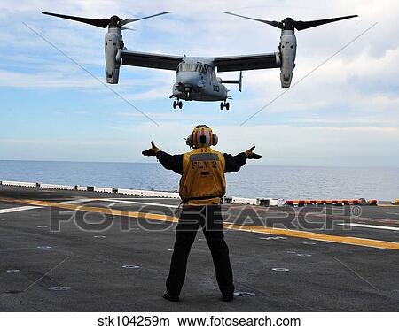 An MV-22 Osprey tiltrotor aircraft approaches the flight deck. View Large Photo Image Picture - An MV-22 Osprey tiltrotor aircraft approaches the flight deck.. Fotosearch