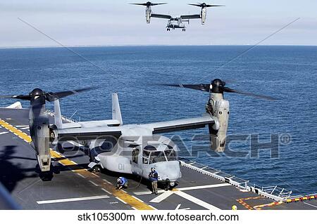 An MV-22 Osprey tiltrotor aircraft lands aboard USS Kearsarge. View Large Photo Image Picture - An MV-22 Osprey tiltrotor aircraft lands aboard USS Kearsarge.. Fotosearch