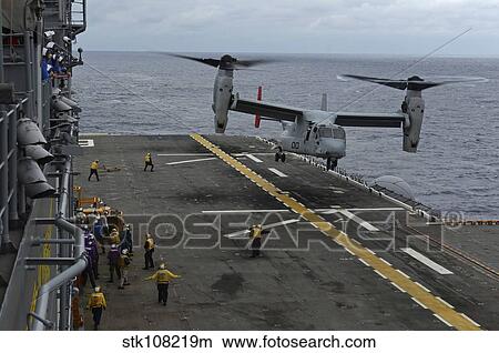 An MV-22 Osprey tiltrotor aircraft prepares to land on the flight deck. View Large Photo Image Picture - An MV-22 Osprey tiltrotor aircraft prepares to land on the flight deck.. Fotosearch