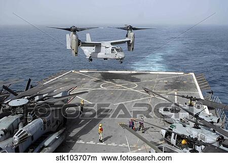 An MV-22B Osprey lands aboard the amphibious transport dock ship USS Mesa Verde. View Large Photo Image Picture - An MV-22B Osprey lands aboard the amphibious transport dock ship USS Mesa Verde.. Fotosearch