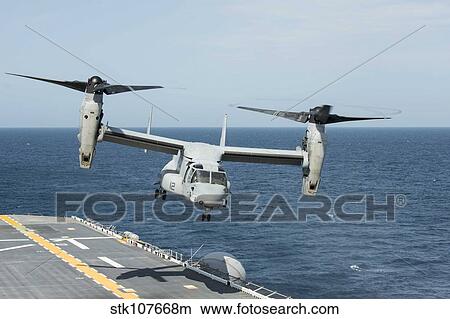 An MV-22B Osprey lands aboard the amphibious assault ship USS Wasp. View Large Photo Image Picture - An MV-22B Osprey lands aboard the amphibious assault ship USS Wasp.. Fotosearch