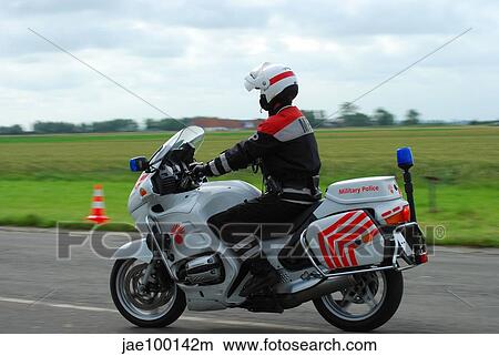 Picture - An officer of the Military Police of Belgium on his BMW R 1150 RT motorcycle.. Fotosearch