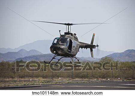 An OH-58 Kiowa helicopter of the U. S. Army landing at Pinal Airpark, Arizona. View Large Photo Image Picture - An OH-58 Kiowa helicopter of the U. S. Army landing at Pinal Airpark, Arizona.. Fotosearch