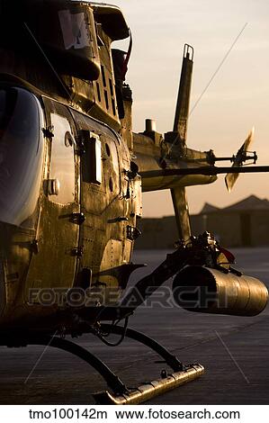 An OH-58D Kiowa during sunset. View Large Photo Image Picture - An OH-58D Kiowa during sunset.. Fotosearch