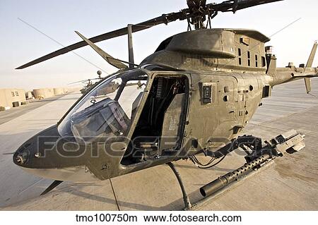 An OH-58D Kiowa helicopter on the tarmac at COB Speicher, Iraq. View Large Photo Image Picture - An OH-58D Kiowa helicopter on the tarmac at COB Speicher, Iraq.. Fotosearch