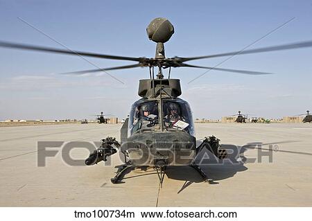An OH-58D Kiowa helicopter prepares for liftoff from COB Speicher. View Large Photo Image Picture - An OH-58D Kiowa helicopter prepares for liftoff from COB Speicher.. Fotosearch
