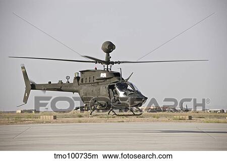 An OH-58D Kiowa helicopter takes off from COB Speicher. View Large Photo Image Picture - An OH-58D Kiowa helicopter takes off from COB Speicher.. Fotosearch