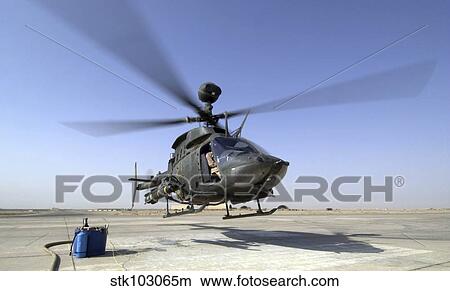 Picture - An OH-58D Kiowa Warrior helicopter taking off from Forward Operating Base MacKenzie in Iraq. . Fotosearch