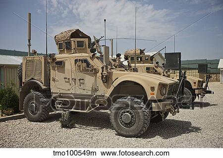 An Oshkosh M-ATV parked at a military base in Afghanistan. View Large Photo Image Picture - An Oshkosh M-ATV parked at a military base in Afghanistan.. Fotosearch