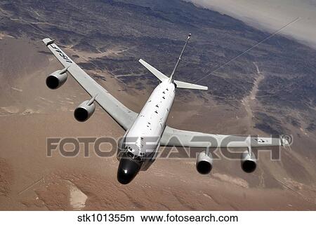 Picture - An RC-135 Rivet Joint reconnaissance aircraft moves into position to refuel.. Fotosearch