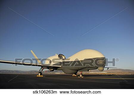 An RQ-4 Global Hawk unmanned aerial vehicle sits on the flight line. View Large Photo Image Picture - An RQ-4 Global Hawk unmanned aerial vehicle sits on the flight line.. Fotosearch