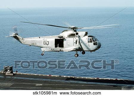 An SH-3H Sea King helicopter prepares to land on USS Saratoga. View Large Photo Image Picture - An SH-3H Sea King helicopter prepares to land on USS Saratoga.. Fotosearch