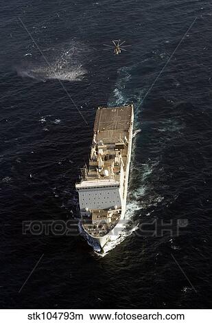 An SH-60 Sea Hawk approaches the Royal Navy landing ship dock RFA Lyme Bay. View Large Photo Image Picture - An SH-60 Sea Hawk approaches the Royal Navy landing ship dock RFA Lyme Bay.. Fotosearch