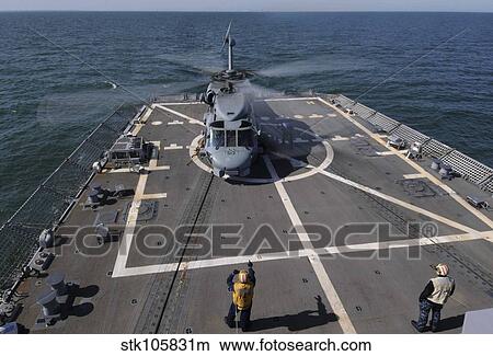 An SH-60B Sea Hawk lands on the flight deck of USS Forrest Sherman. View Large Photo Image Picture - An SH-60B Sea Hawk lands on the flight deck of USS Forrest Sherman.. Fotosearch