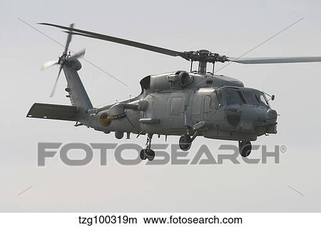 Picture - An SH-60B Seahawk of the Spanish Navy in flight over Rota, Spain.. Fotosearch