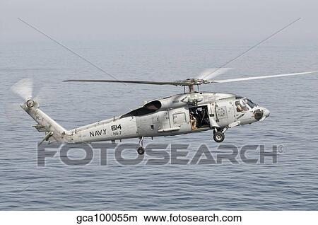 An SH-60F Seahawk gets airborne from the deck of USS Harry S. Truman. View Large Photo Image Picture - An SH-60F Seahawk gets airborne from the deck of USS Harry S. Truman.. Fotosearch