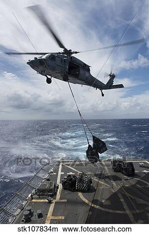 An SH-60S Sea Hawk delivers supplies on the flight deck fo USS Preble. View Large Photo Image Picture - An SH-60S Sea Hawk delivers supplies on the flight deck fo USS Preble.. Fotosearch