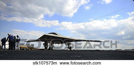 Picture - An X-47B Unmanned Combat Air System on the flight deck of USS George H. W. Bush.. Fotosearch