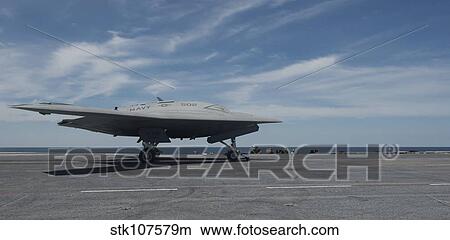 An X-47B Unmanned Combat Air System launches from USS George H. W. Bush. View Large Photo Image Picture - An X-47B Unmanned Combat Air System launches from USS George H. W. Bush.. Fotosearch
