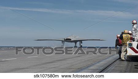 An X-47B Unmanned Combat Air System launches from USS George H. W. Bush. View Large Photo Image Picture - An X-47B Unmanned Combat Air System launches from USS George H. W. Bush.. Fotosearch