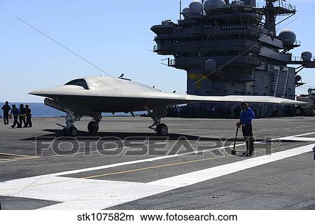 Picture - An X-47B Unmanned Combat Air System aboard USS George H. W. Bush.. Fotosearch