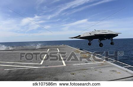 An X-47B Unmanned Combat Air System launches from USS George H. W. Bush. View Large Photo Image Picture - An X-47B Unmanned Combat Air System launches from USS George H. W. Bush.. Fotosearch