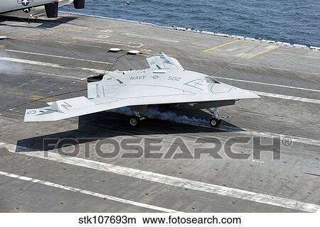 An X-47B Unmanned Combat Air System makes an arrested landing. View Large Photo Image Picture - An X-47B Unmanned Combat Air System makes an arrested landing.. Fotosearch