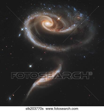 Arp 273 interacting galaxies in Andromeda. View Large Photo Image Stock Photograph - Arp 273 interacting galaxies in Andromeda.. Fotosearch