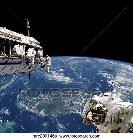 Astronauts performing work on space station while orbiting above Earth. View Large Photo Image Stock Photograph - Astronauts performing work on space station while orbiting above Earth.. Fotosearch