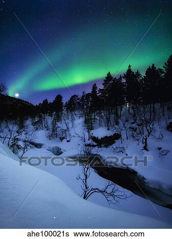 Stock Photograph - Aurora and a Full Moon over Tennevik River, Troms County, Norway.. Fotosearch