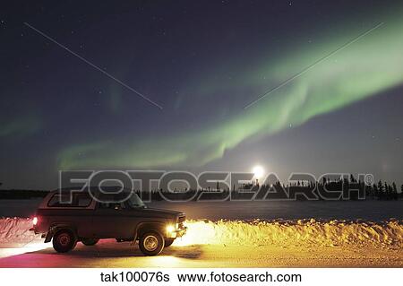 Stock Photograph - Aurora and old truck, Walsh Lake, Yellowknife, Northwest Territories, Canada.. Fotosearch