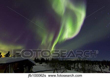 Aurora borealis above a cabin at Fish Lake, Whitehorse, Yukon, Canada. View Large Photo Image Stock Photograph - Aurora borealis above a cabin at Fish Lake, Whitehorse, Yukon, Canada.. Fotosearch