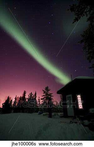 Aurora borealis above cabin, Northwest Territories, Canada. View Large Photo Image Stock Photograph - Aurora borealis above cabin, Northwest Territories, Canada.. Fotosearch