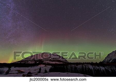 Aurora borealis and Milky Way over Carcross, Yukon, Canada. View Large Photo Image Stock Photograph - Aurora borealis and Milky Way over Carcross, Yukon, Canada.. Fotosearch