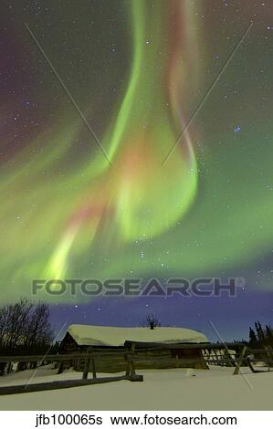 Aurora borealis and Orion's Belt above a log cabin at Whitehorse, Yukon, Canada. View Large Photo Image Stock Photograph - Aurora borealis and Orion's Belt above a log cabin at Whitehorse, Yukon, Canada.. Fotosearch