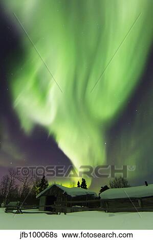 Aurora borealis and the Big Dipper above a log cabin at Whitehorse, Yukon, Canada. View Large Photo Image Stock Photograph - Aurora borealis and the Big Dipper above a log cabin at Whitehorse, Yukon, Canada.. Fotosearch