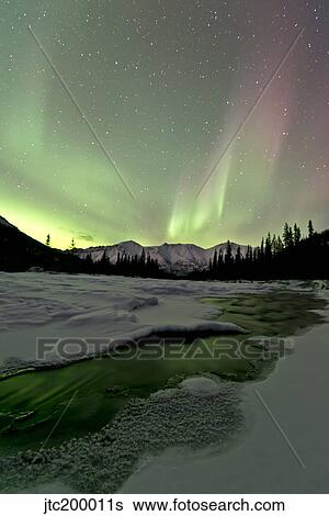Stock Photograph - Aurora borealis, Annie Lake, Yukon, Canada.. Fotosearch