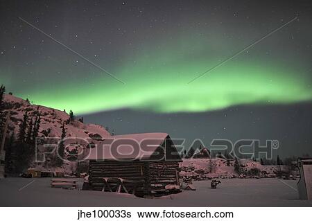 Aurora borealis over a cabin, Northwest Territories, Canada. View Large Photo Image Stock Photograph - Aurora borealis over a cabin, Northwest Territories, Canada.. Fotosearch