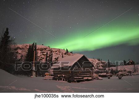 Aurora borealis over a cabin, Northwest Territories, Canada. View Large Photo Image Stock Photograph - Aurora borealis over a cabin, Northwest Territories, Canada.. Fotosearch