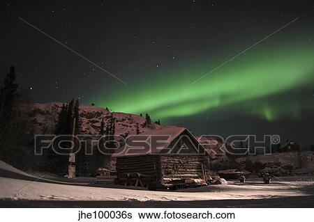 Aurora borealis over a cabin, Northwest Territories, Canada. View Large Photo Image Stock Photograph - Aurora borealis over a cabin, Northwest Territories, Canada.. Fotosearch