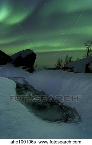 Aurora Borealis over a frozen river, Nordland, Norway. View Large Photo Image Stock Photograph - Aurora Borealis over a frozen river, Nordland, Norway.. Fotosearch