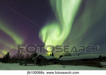 Aurora borealis over a log cabin in Whitehorse, Yukon, Canada. View Large Photo Image Stock Photograph - Aurora borealis over a log cabin in Whitehorse, Yukon, Canada.. Fotosearch