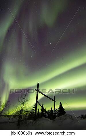 Aurora borealis over a ranch, Whitehorse, Yukon, Canada. View Large Photo Image Stock Photograph - Aurora borealis over a ranch, Whitehorse, Yukon, Canada.. Fotosearch