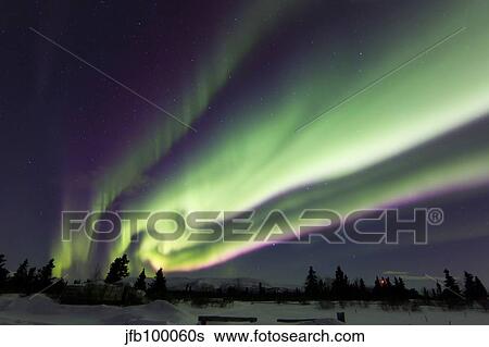 Aurora borealis over a ranch, Whitehorse, Yukon, Canada. View Large Photo Image Stock Photograph - Aurora borealis over a ranch, Whitehorse, Yukon, Canada.. Fotosearch