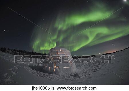 Aurora borealis over an igloo on Walsh Lake, Canada. View Large Photo Image Stock Photograph - Aurora borealis over an igloo on Walsh Lake, Canada.. Fotosearch