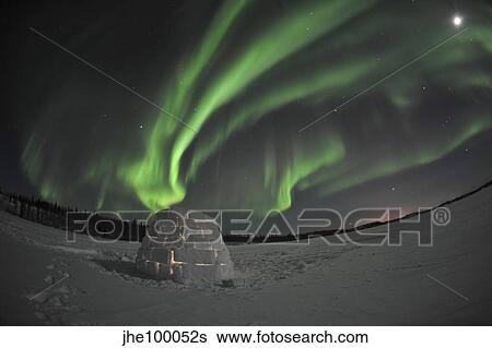 Aurora borealis over an igloo on Walsh Lake, Canada. View Large Photo Image Stock Photograph - Aurora borealis over an igloo on Walsh Lake, Canada.. Fotosearch