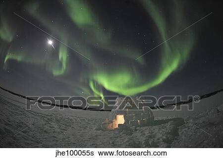 Aurora borealis over an igloo on Walsh Lake, Canada. View Large Photo Image Stock Photograph - Aurora borealis over an igloo on Walsh Lake, Canada.. Fotosearch