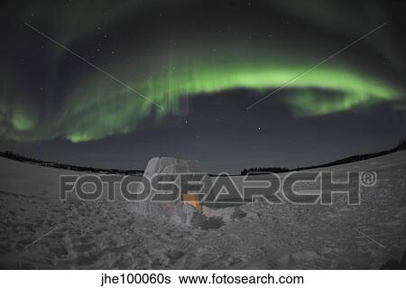Aurora borealis over an igloo on Walsh Lake, Canada. View Large Photo Image Stock Photograph - Aurora borealis over an igloo on Walsh Lake, Canada.. Fotosearch