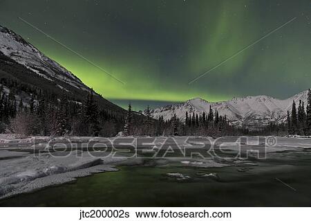 Stock Photograph - Aurora borealis over Annie Lake, Yukon, Canada.. Fotosearch