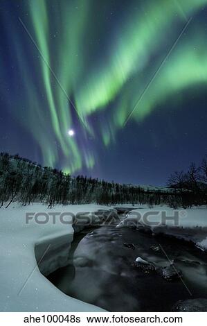 Aurora Borealis over Blafjellelva River in Troms County, Norway. View Large Photo Image Stock Photograph - Aurora Borealis over Blafjellelva River in Troms County, Norway.. Fotosearch